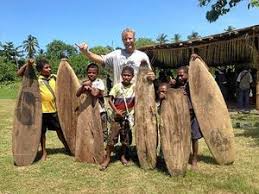 Tom with local board builders, Tupira Surf Camp, Papua New Guinea